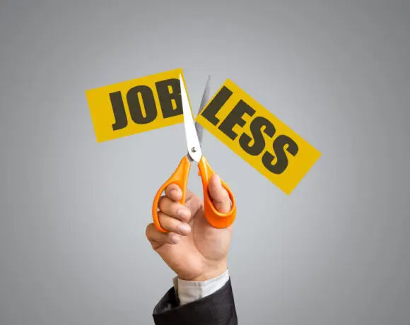 Job losses and vacant posts in AYUSH and homeopathy institutions highlighted by scissors cutting ‘Job Less’ sign