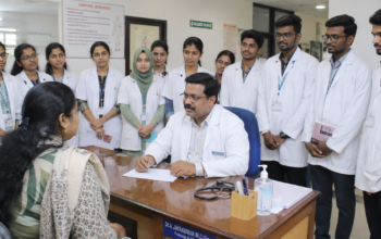 Medical students observing a faculty member during outpatient clinical training in a hospital OPD.