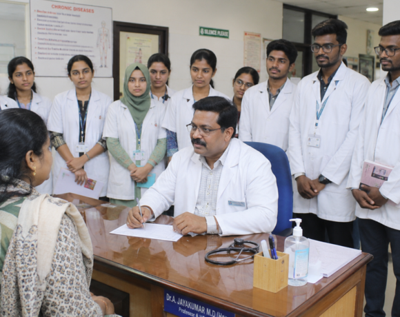 Medical students observing a faculty member during outpatient clinical training in a hospital OPD.